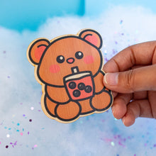 Load image into Gallery viewer, Belugabee Bamboo Sticker: Irresistibly cute brown bear enjoying chunky boba from a cup, sucking on a straw. Elevate your style with this eco-friendly 3x3-inch sticker. 🐻🍵 #BambooSticker #ChunkyBobaBear #CuteBobaArt