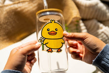 Load image into Gallery viewer, Belugabee Bamboo Sticker: Adorable design of a duck holding a vibrant flower, enhancing the charm of your glass cup. Elevate your style with this eco-friendly 3x3-inch bamboo sticker. 🦆🌸 #BambooSticker #DuckAndFlower #GlassCupDecor