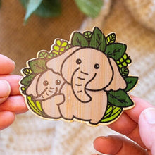 Load image into Gallery viewer, Belugabee Bamboo Sticker: Heartwarming design of an elephant family symbolizing unity and love, crafted on eco-friendly bamboo. Elevate your style with this charming 3x3-inch sticker. 🐘💕 #BambooSticker #ElephantFamily #CuteDesign