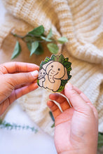 Load image into Gallery viewer, Belugabee Bamboo Sticker: Demonstrating flexibility as the heartwarming design of an elephant family is gently bent. Elevate your style with this charming and eco-friendly 3x3-inch bamboo sticker. 🐘💕 #BambooSticker #ElephantFamily #FlexibilityAndDurability