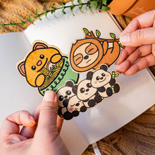 Load image into Gallery viewer, A surprise collection of eco-friendly bamboo stickers featuring adorable animals, whimsical creatures, and delightful designs! Each pack contains a unique mix, making it a fun mystery to unwrap. Perfect for decorating water bottles, laptops, journals, and more!"