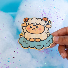Load image into Gallery viewer, Belugabee Dreamy Sheep Bamboo Sticker: Whimsical design featuring a dreamy sheep on clouds with two twinkling stars. Elevate your style with this charming 3x3-inch eco-friendly bamboo sticker. 🐑✨ #BambooSticker #DreamySheep #CuteDesign