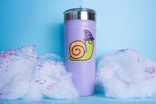 Load image into Gallery viewer, The Wizard Snail Bamboo Sticker is an eco-friendly decorative item featuring a whimsical illustration of a snail adorned with wizard attire. Crafted from 100% sustainable bamboo, this sticker measures approximately 3x3 inches and is designed to be both fade and weather-resistant. Its strong 3M water-resistant adhesive ensures durability across various surfaces, including hydro flasks, journals, and tote bags. This sticker combines environmental consciousness with a touch of fantasy, making it a delightful a