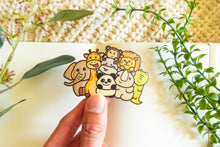 Load image into Gallery viewer, A Zoo Animals Bamboo Sticker is an eco-friendly decorative item featuring illustrations of various zoo animals, such as pandas, elephants, and giraffes, printed on sustainable bamboo material. These stickers are designed to be durable and versatile, suitable for application on items like hydro flasks, journals, and tote bags. The strong adhesive ensures they stay securely in place over time.