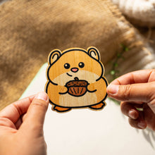 Load image into Gallery viewer, Belugabee Bamboo Sticker: Adorable hamster in acorn design, crafted on eco-friendly bamboo. Elevate your style with this charming 3x3-inch sticker. 🐹🌿 #BambooSticker #HamsterAcornDesign #CuteDecor
