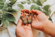 Load image into Gallery viewer, Monarch Butterfly Wooden Keychain - A single wooden keychain adorned with the enchanting beauty of a colorful monarch butterfly. 🦋✨ #ButterflyKeychain #WoodenAccessory #NatureInspired
