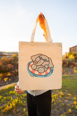 Illustration of an elephant swimming underwater on a durable tote bag.