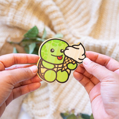 An eco-friendly bamboo sticker featuring a turtle with a strawberry-patterned shell.