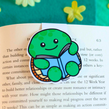 Load image into Gallery viewer, A magnetic bookmark featuring a turtle design, printed on high gloss cardstock, available on the company&#39;s website
