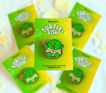 Load image into Gallery viewer, 
A vibrant collection of wooden pins featuring adorable animal designs. The set includes a cheerful turtle with a bright shell, a cute cow with soft spots, a happy ducky with a tiny beak, and a playful frog mid-hop. There’s also a boba bear and boba panda, each holding a cup of boba tea with tapioca pearls, a reading panda (“Pu”) engrossed in a book, and a hungry kitty with a charmingly mischievous expression. Each pin is detailed with colorful accents and natural wood grain, adding personality and whimsy t
