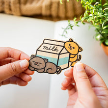 Load image into Gallery viewer, Two playful kittens, one grey and one orange, frolicking with a milk carton box in a heartwarming bamboo sticker design. 🐱🥛 #KittenPlay #MilkCartonFun #BambooSticker
