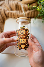 Load image into Gallery viewer, Monkey Twins Bamboo Sticker Alt Text on Glass Cup: Two playful monkeys, one atop the other, holding bananas, now adorning a clear glass cup, adding a touch of charm to your drinkware. 🐒🍌 #MonkeyTwins #BambooSticker #GlassCupDecor
