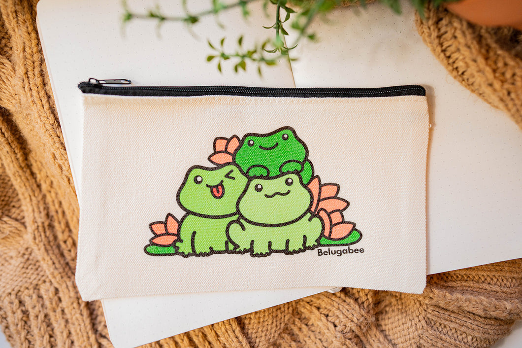 Dive into whimsy with a pencil pouch adorned by frogs and lilies, the enchanting design bringing nature's charm to your stationery essentials. 🐸🌼✏️ #PencilPouch #FrogAndLilies #NatureInspiredDesign