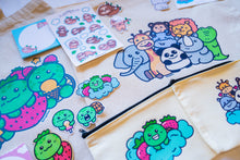 Load image into Gallery viewer, Unboxing a Belugabee Grade A Mystery Bag: Excitement as hands unwrap cute surprises, including tote bags, pencil pouches, memo pads, bamboo stickers, sticker sheets, die-cut stickers, and pins. A joyous discovery awaits! 🎁🛍️ #MysteryBagUnboxing #SurpriseGifts #CuteSurprises
