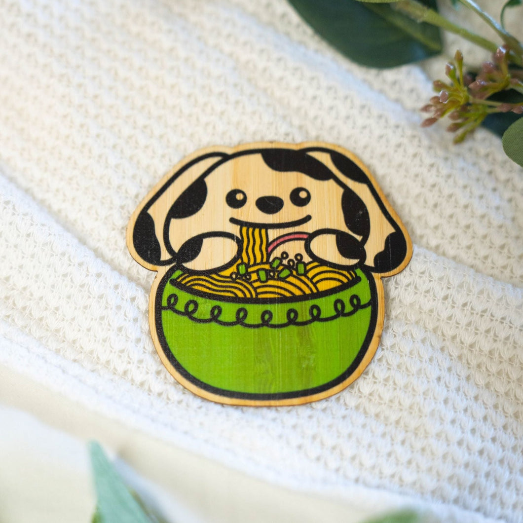 Belugabee Bamboo Sticker: Playful Dalmatian dog slurping noodles from a vibrant green bowl of ramen. Elevate your style with this adorable 3x3-inch eco-friendly sticker. 🐾🍜 #BambooSticker #DalmatianDogRamen #NoodleLover