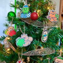 Load image into Gallery viewer, Belugabee Wooden Holiday Ornaments: A festive Christmas tree adorned with charming and whimsical holiday ornaments, including the Gifting Turtle and more. Elevate your holiday decor with these delightful additions. 🎄🐢🎁 #WoodenHolidayOrnaments #FestiveDecor #HolidayCheer
