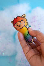 Load image into Gallery viewer, A fluffy alpaca llama with a soft rainbow-colored coat, standing happily with a cheerful expression. This eco-friendly bamboo sticker features a cute, hand-drawn style, perfect for adding a colorful touch to laptops, water bottles, and journals! 🌈🦙✨
