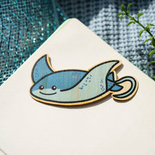 Load image into Gallery viewer, The Stingray Bamboo Sticker is an eco-friendly accessory featuring a charming illustration of a stingray. Crafted from 100% sustainable bamboo, this sticker measures approximately 3x3 inches. 
