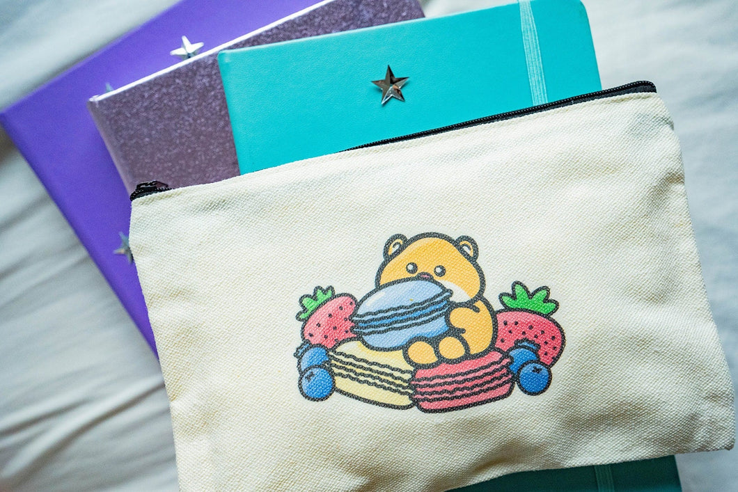Hungry Hamster Pencil Pouch Alt Text: Adorable pencil pouch featuring a hungry hamster munching on a macaroon, surrounded by sweet treats like macaroons and berries, a whimsical and delightful design to brighten up your stationery collection. 🐹🍬✏️ #PencilPouch #CuteHamster #MacaroonDesign