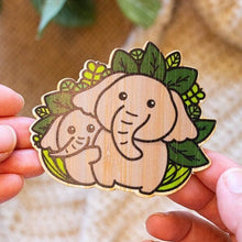 Load image into Gallery viewer, Belugabee Bamboo Sticker: Heartwarming design of an elephant family symbolizing unity and love, crafted on eco-friendly bamboo. Elevate your style with this charming 3x3-inch sticker. 🐘💕 #BambooSticker #ElephantFamily #CuteDesign
