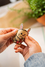 Load image into Gallery viewer, Belugabee Bamboo Sticker: Demonstrating flexibility and durability – Bunny and Carrot design showcased in a bent position. Elevate your style with this eco-friendly 3x3-inch sticker. 🐰🥕 #BambooSticker #FlexibilityAndDurability #BunnyAndCarrot
