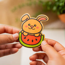 Load image into Gallery viewer, Belugabee Bamboo Sticker: Adorable brown bunny enjoying watermelon design. Elevate your style with this eco-friendly 3x3-inch sticker. 🐰🍉 #BambooSticker #BrownBunny #WatermelonDesign
