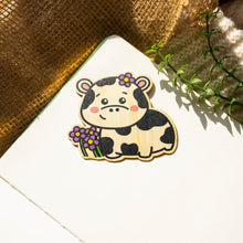 Load image into Gallery viewer, Belugabee Bamboo Wood Sticker: Happy cow with a bright smile amidst lovely purple flowers. Elevate your style with this eco-friendly 3x3-inch sticker. 🐮🌸 #BambooWoodSticker #HappyCowAndFlowers #NatureInspiredArt
