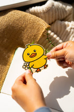 Load image into Gallery viewer, Belugabee Bamboo Sticker: Adorable design of a duck holding a vibrant flower, crafted on eco-friendly bamboo. Elevate your style with this charming 3x3-inch sticker. 🦆🌸 #BambooSticker #DuckAndFlower #CuteDesign
