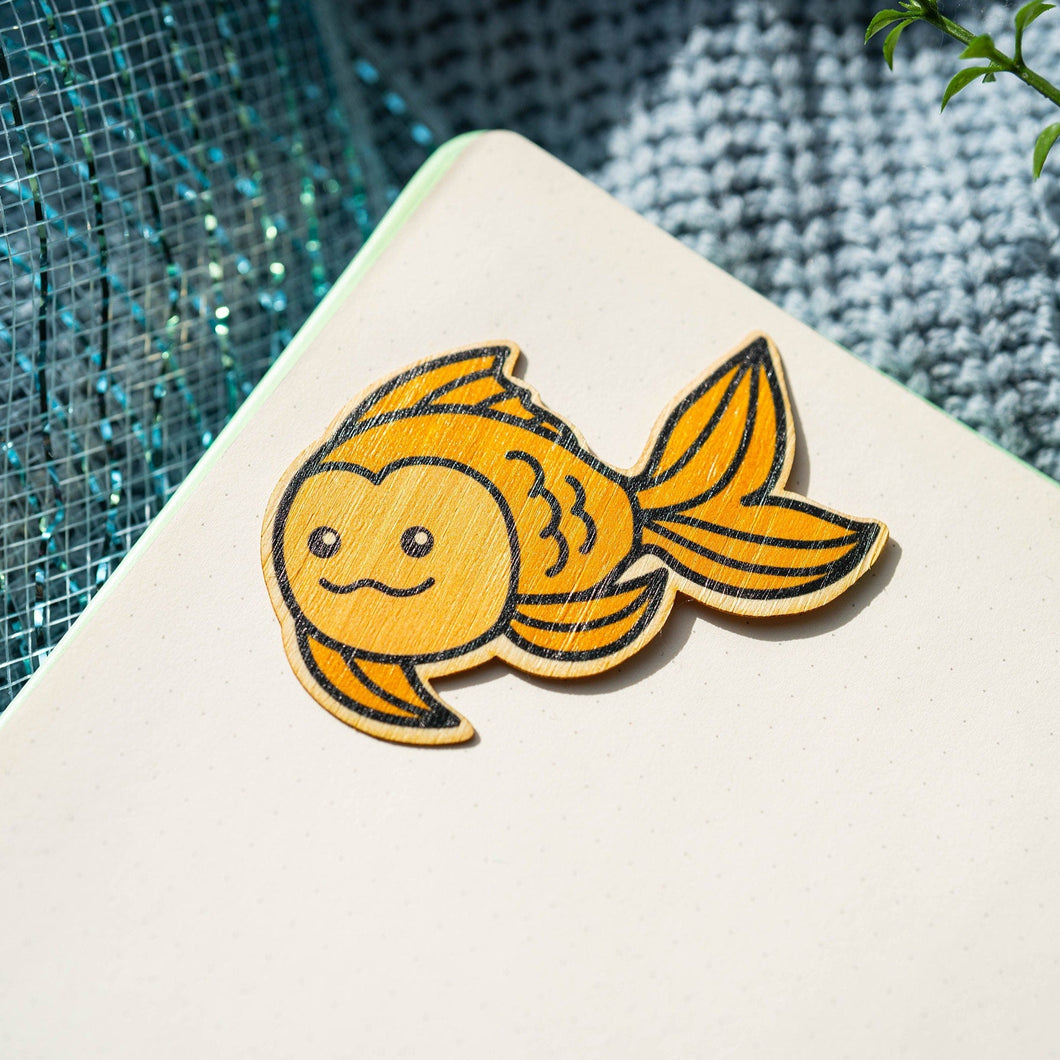 Belugabee Bamboo Sticker: Whimsical goldfish design, crafted on eco-friendly bamboo. Elevate your style with this charming 3x3-inch sticker. 🐠🌿 #BambooSticker #GoldfishDesign #NatureInspiredArt