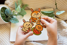 Load image into Gallery viewer, Belugabee Bamboo Stickers: Three bunny variations in brown, white, watermelon, and carrot designs. Elevate your style with this eco-friendly set of 3x3-inch stickers. 🐰🥕🍉 #BambooStickers #BunnyVariations

